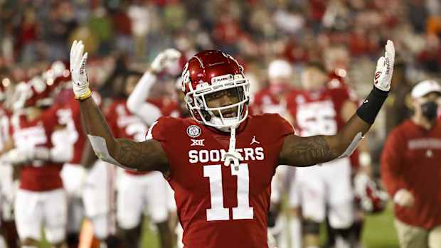 Nov 21, 2020; Norman, Oklahoma, USA; Oklahoma Sooners linebacker Nik Bonitto (11) reacts at the end of the first half against the Oklahoma State Cowboys at Gaylord Family-Oklahoma Memorial Stadium. Mandatory Credit: Kevin Jairaj-USA TODAY Sports